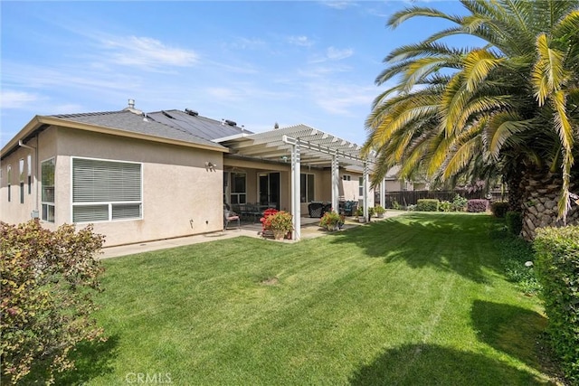 2327 Via Calle Ct, Durham, CA 95938 - back of house featuring a patio, stucco siding, a pergola, fence, and a lawn