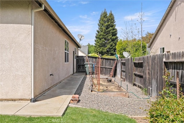2327 Via Calle Ct, Durham, CA 95938 - exterior space featuring a fenced backyard and stucco siding