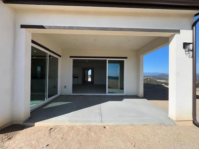 back of property with stucco siding