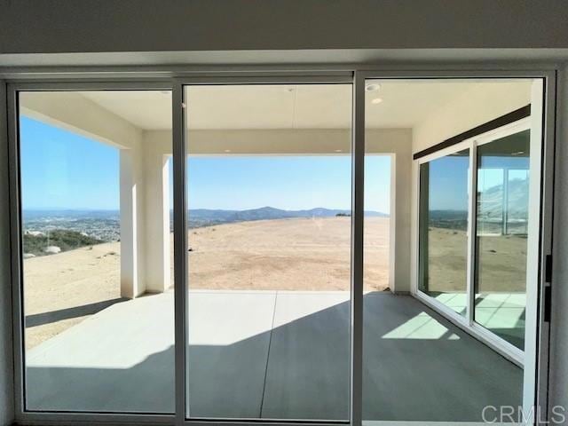 doorway featuring a mountain view
