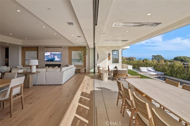 dining space featuring light wood-style floors, visible vents, and recessed lighting