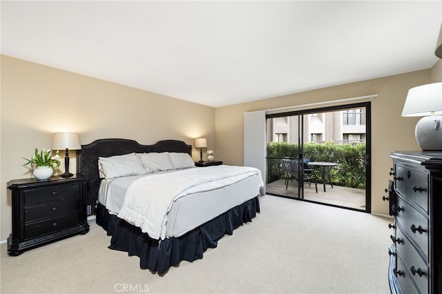 bedroom featuring access to exterior and carpet flooring