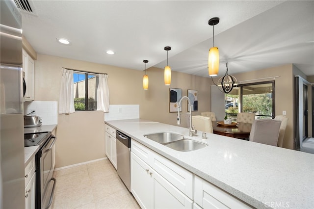 kitchen with stainless steel appliances, plenty of natural light, light countertops, and a sink