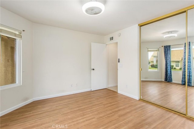883 Riviera Ave, Banning, CA 92220 - unfurnished bedroom with light wood-type flooring, a closet, and baseboards