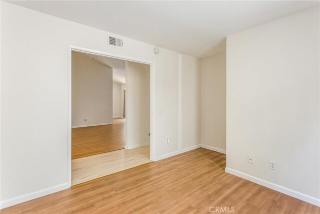 883 Riviera Ave, Banning, CA 92220 - empty room with light wood-style flooring and baseboards