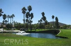 883 Riviera Ave, Banning, CA 92220 - view of community with a water view and a lawn