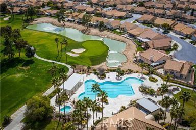 883 Riviera Ave, Banning, CA 92220 - aerial perspective of suburban area with a pool area, a large body of water, and a golf course
