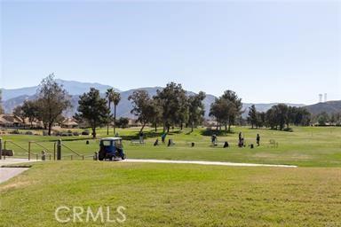 883 Riviera Ave, Banning, CA 92220 - view of home's community featuring a mountain view and a lawn