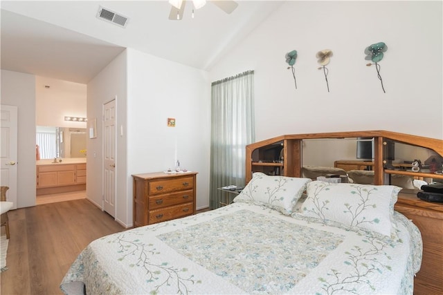 750 Diamante, San Jacinto, CA 92583 - bedroom with wood finished floors, lofted ceiling, connected bathroom, ceiling fan, and a sink