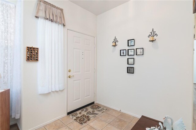 750 Diamante, San Jacinto, CA 92583 - entryway with baseboards and light tile patterned floors