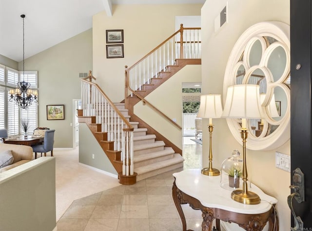 stairs featuring high vaulted ceiling, a chandelier, baseboards, and carpet floors