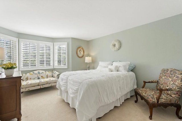 bedroom with light carpet