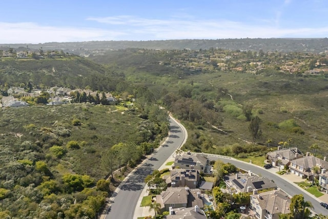 aerial view of property's location with nearby suburban area
