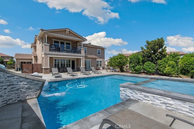 16550 Catalonia Dr, Riverside, CA 92504 - view of pool featuring a patio area, a pool with connected hot tub, and fence
