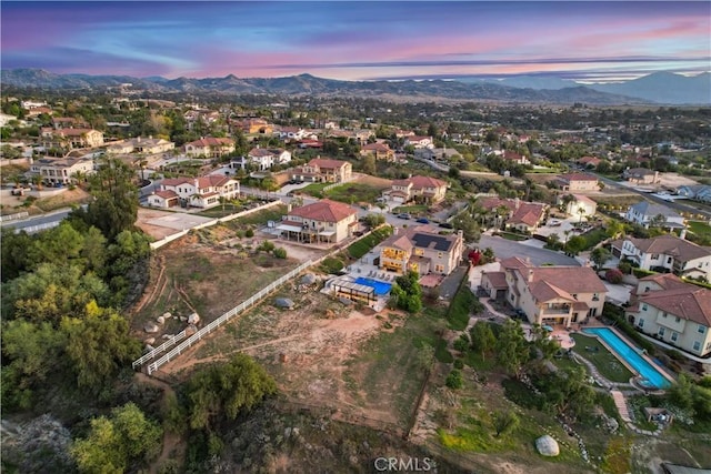 16550 Catalonia Dr, Riverside, CA 92504 - aerial view at dusk of a mountain view and a residential view