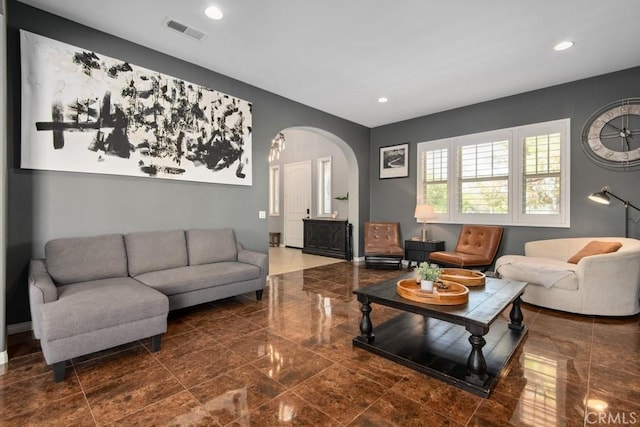16550 Catalonia Dr, Riverside, CA 92504 - living room featuring arched walkways, baseboards, and recessed lighting