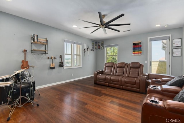 living area with visible vents, baseboards, recessed lighting, wood finished floors, and a ceiling fan