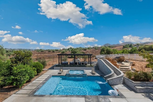view of pool featuring a fenced backyard, a fenced in pool, an in ground hot tub, a patio area, and a mountain view