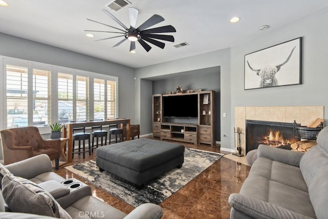 16550 Catalonia Dr, Riverside, CA 92504 - living room featuring a ceiling fan, recessed lighting, a fireplace, and baseboards