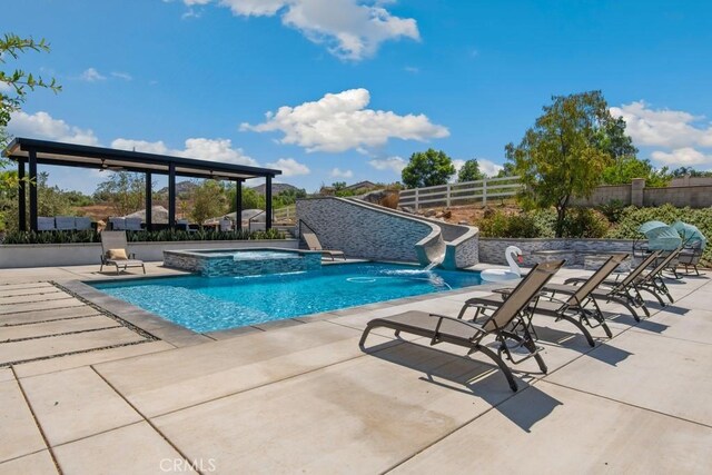16550 Catalonia Dr, Riverside, CA 92504 - view of pool featuring fence, a patio area, a pool with connected hot tub, and a water slide