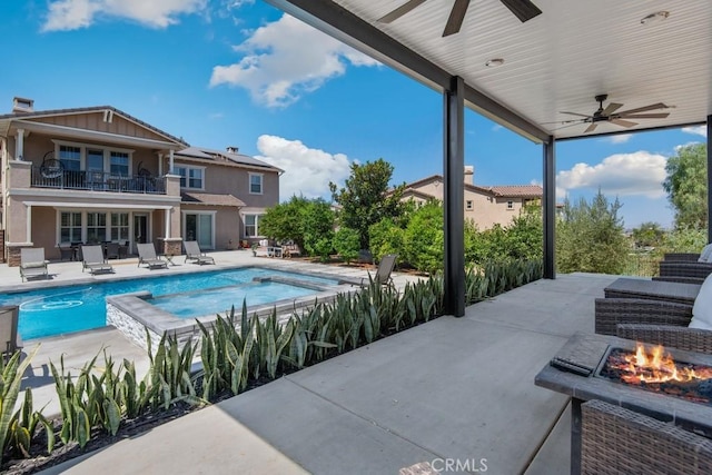 16550 Catalonia Dr, Riverside, CA 92504 - view of swimming pool featuring ceiling fan, an outdoor fire pit, a patio, and a pool with connected hot tub
