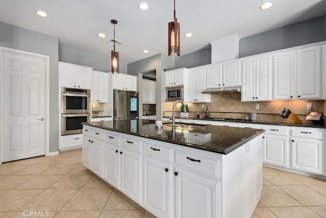 16550 Catalonia Dr, Riverside, CA 92504 - kitchen with appliances with stainless steel finishes, a sink, light tile patterned floors, decorative backsplash, and recessed lighting