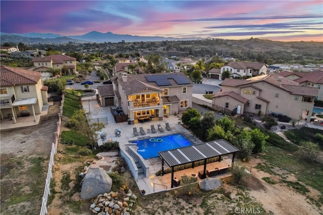 16550 Catalonia Dr, Riverside, CA 92504 - aerial view of residential area featuring a pool and a mountainous background
