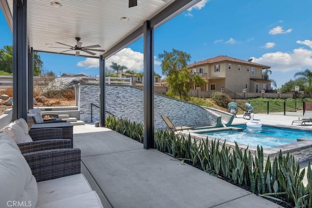 view of patio featuring fence, ceiling fan, and a fenced in pool