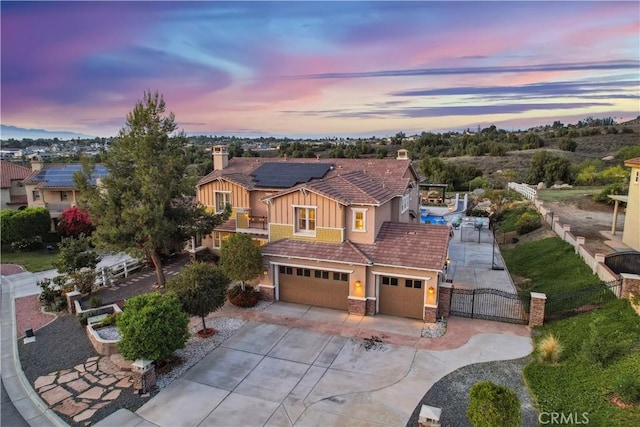 16550 Catalonia Dr, Riverside, CA 92504 - view of front facade featuring a gate, fence, driveway, and a chimney