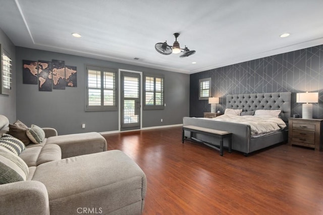 16550 Catalonia Dr, Riverside, CA 92504 - bedroom featuring multiple windows, an accent wall, wood finished floors, baseboards, and recessed lighting