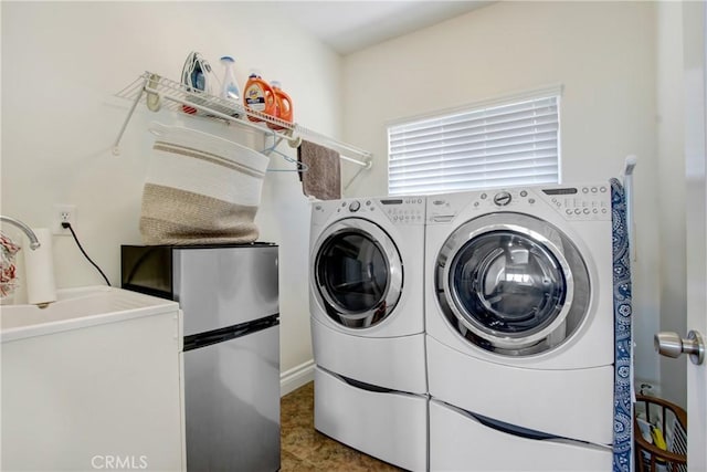 laundry area featuring laundry area and independent washer and dryer
