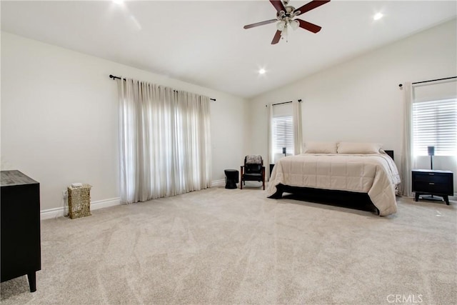 carpeted bedroom with lofted ceiling, baseboards, recessed lighting, and multiple windows