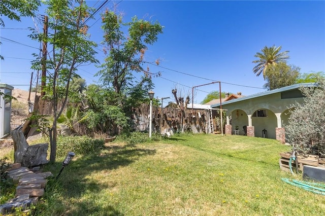 view of yard with fence