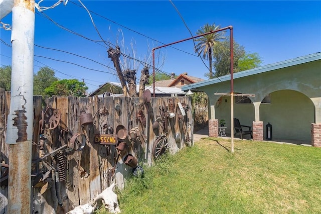 view of yard with a patio area and fence