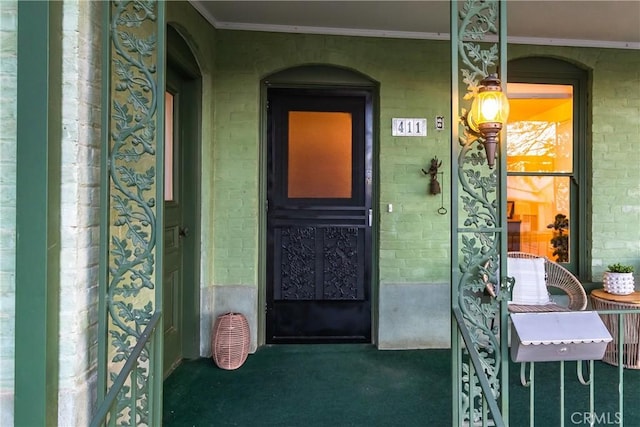 doorway to property featuring covered porch