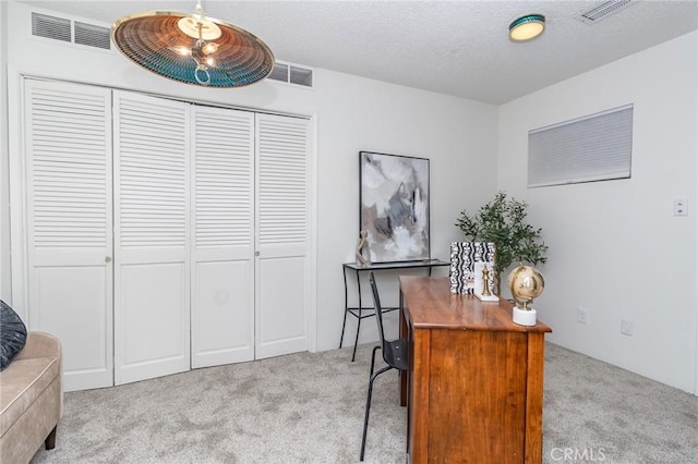office featuring carpet flooring and visible vents
