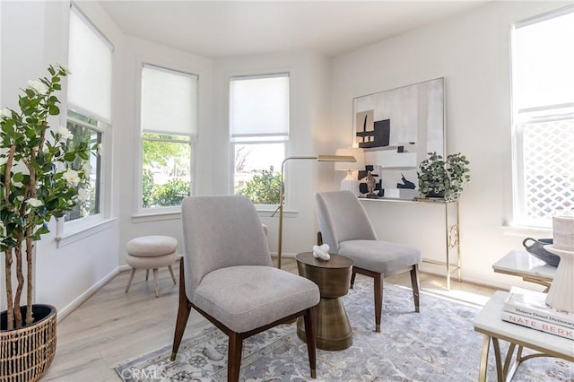 sitting room featuring light wood finished floors and baseboards