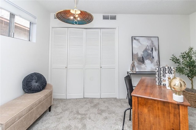 carpeted office space with visible vents
