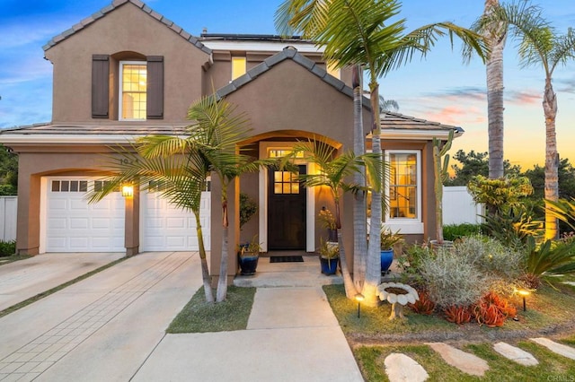1024 Cottage Way, Encinitas, CA 92024 - view of front facade with driveway, stucco siding, an attached garage, and a tile roof