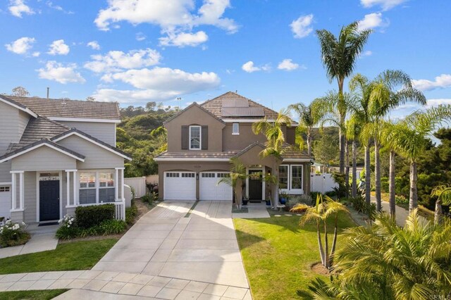1024 Cottage Way, Encinitas, CA 92024 - traditional home featuring a garage, driveway, solar panels, and stucco siding