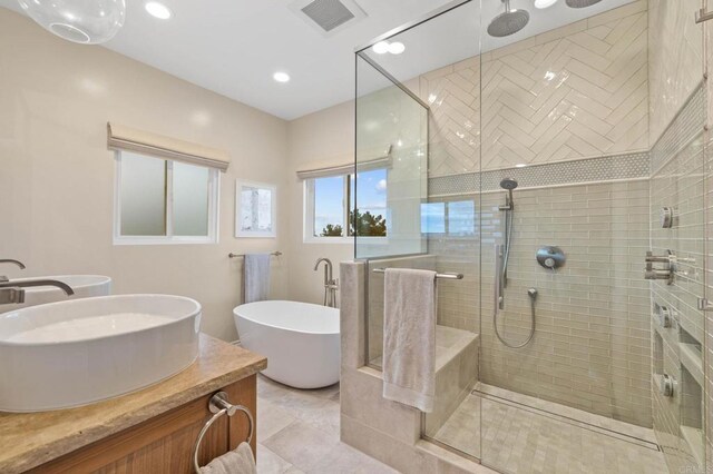 1024 Cottage Way, Encinitas, CA 92024 - bathroom featuring a stall shower, double vanity, a freestanding tub, and recessed lighting