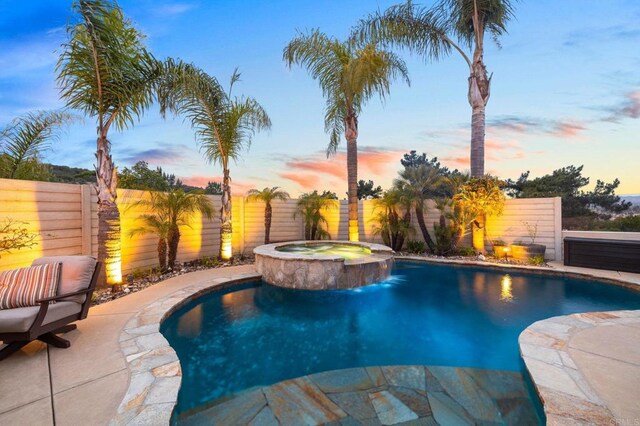 1024 Cottage Way, Encinitas, CA 92024 - pool at dusk with a fenced backyard, a pool with connected hot tub, and a patio