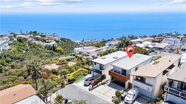 bird's eye view featuring a water view and a residential view