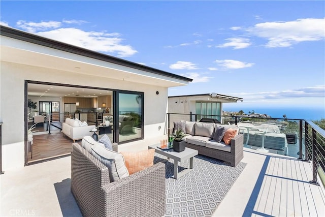 view of patio with an outdoor hangout area and a balcony
