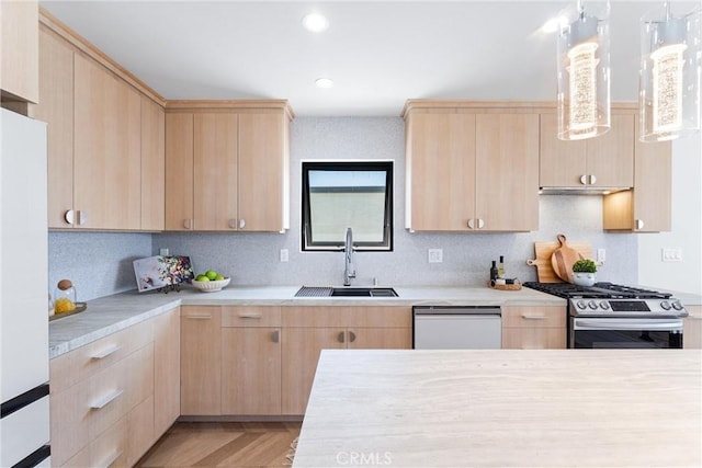 kitchen with white appliances and light brown cabinets