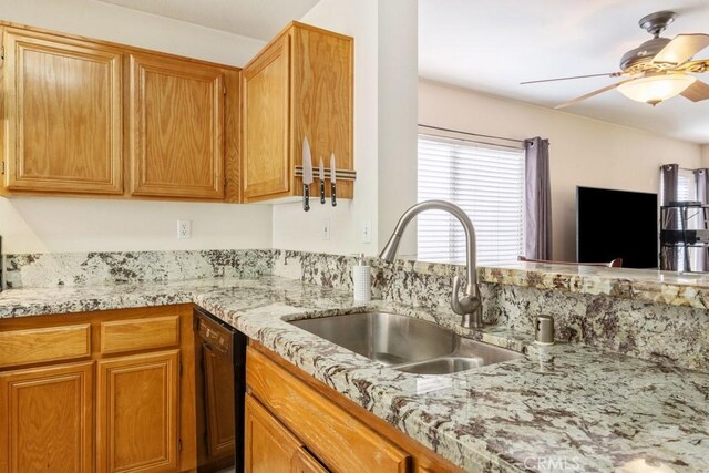 11530 Oak St, Apple Valley, CA 92308 - kitchen with a sink, dishwasher, ceiling fan, and light stone countertops