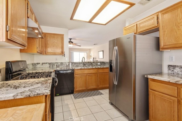 11530 Oak St, Apple Valley, CA 92308 - kitchen with black dishwasher, under cabinet range hood, range with gas cooktop, stainless steel refrigerator with ice dispenser, and a sink