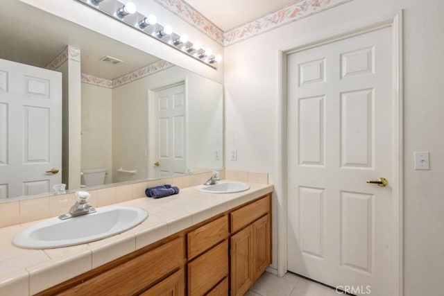 11530 Oak St, Apple Valley, CA 92308 - bathroom featuring double vanity, toilet, and tile patterned flooring
