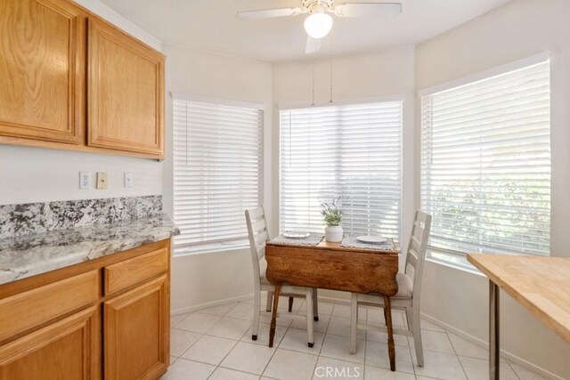 11530 Oak St, Apple Valley, CA 92308 - dining area with baseboards, healthy amount of natural light, ceiling fan, and light tile patterned floors