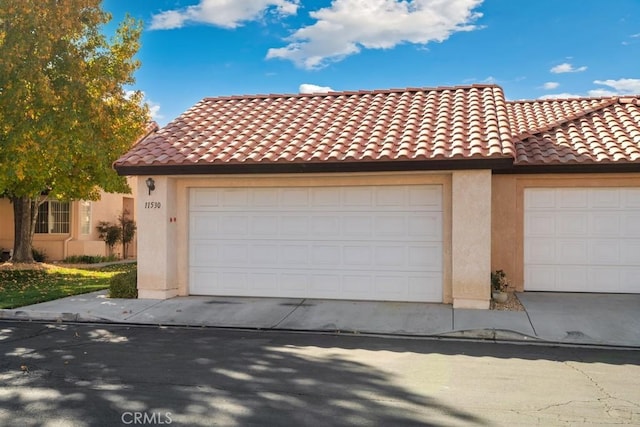 11530 Oak St, Apple Valley, CA 92308 - mediterranean / spanish home with a garage, stucco siding, and a tile roof